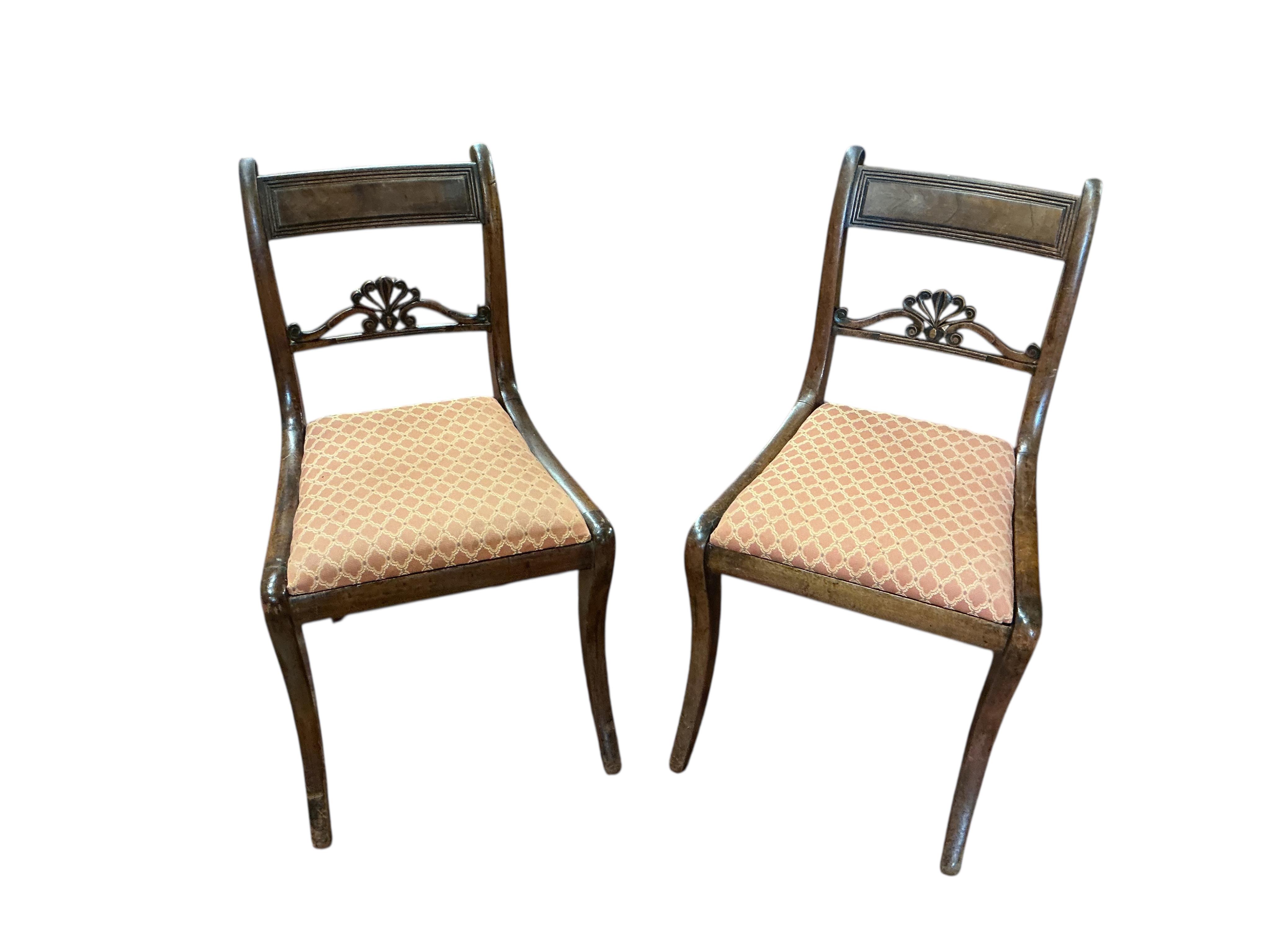A set of eight Regency mahogany dining chairs, two with arms.